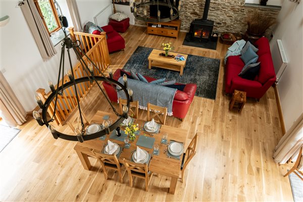 View from above of open plan living space with lounge and dining space